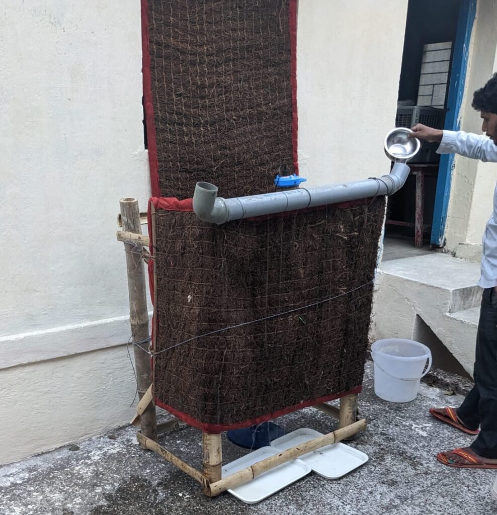 DIY evaporative air cooler made from bamboo, Khus grass and a fan — assembled at Dumbo farm, Jharkhand