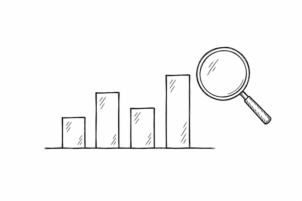 Magnifying glass over a bar chart